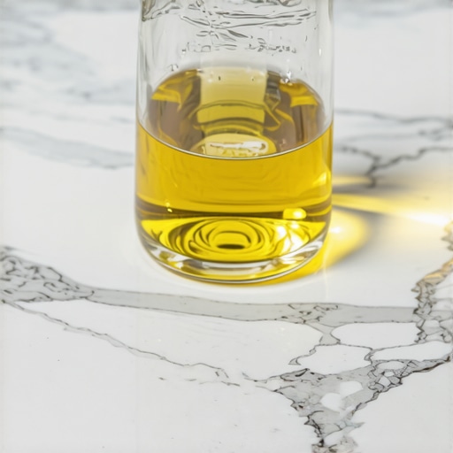 Etched Marble from Improper Cleaning Close up of dull etched spots on a white marble countertop caused by acidic vinegar cleaner.